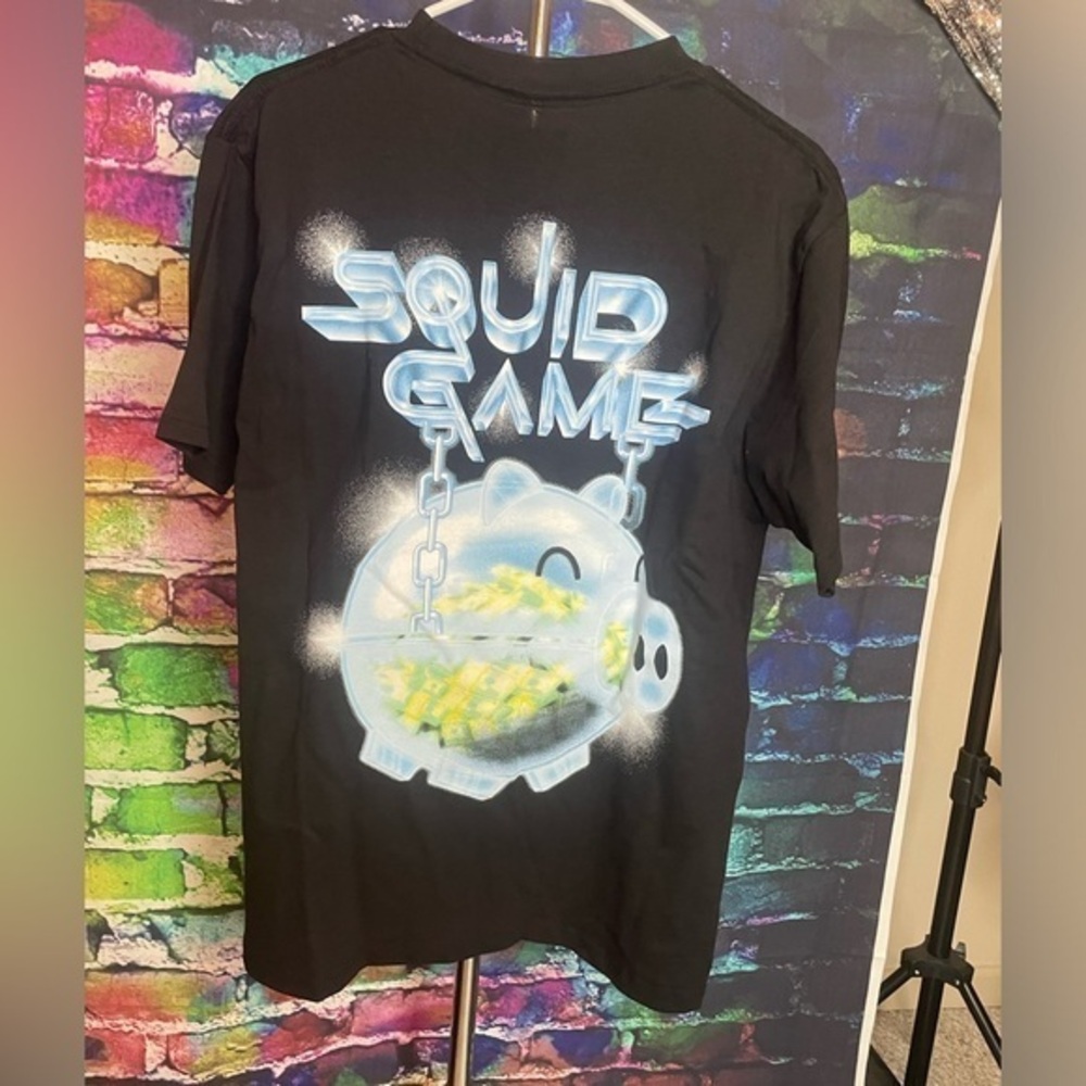 Pacsun Netflix and Market Squid Game Piggy bank black t-shirt.